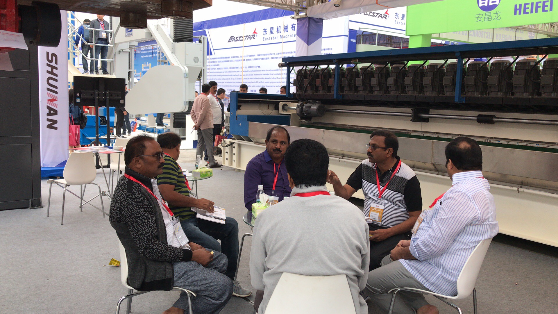 Buyers exploring ShuiNan Machinery stone cutting machines at Xiamen Stone Fair