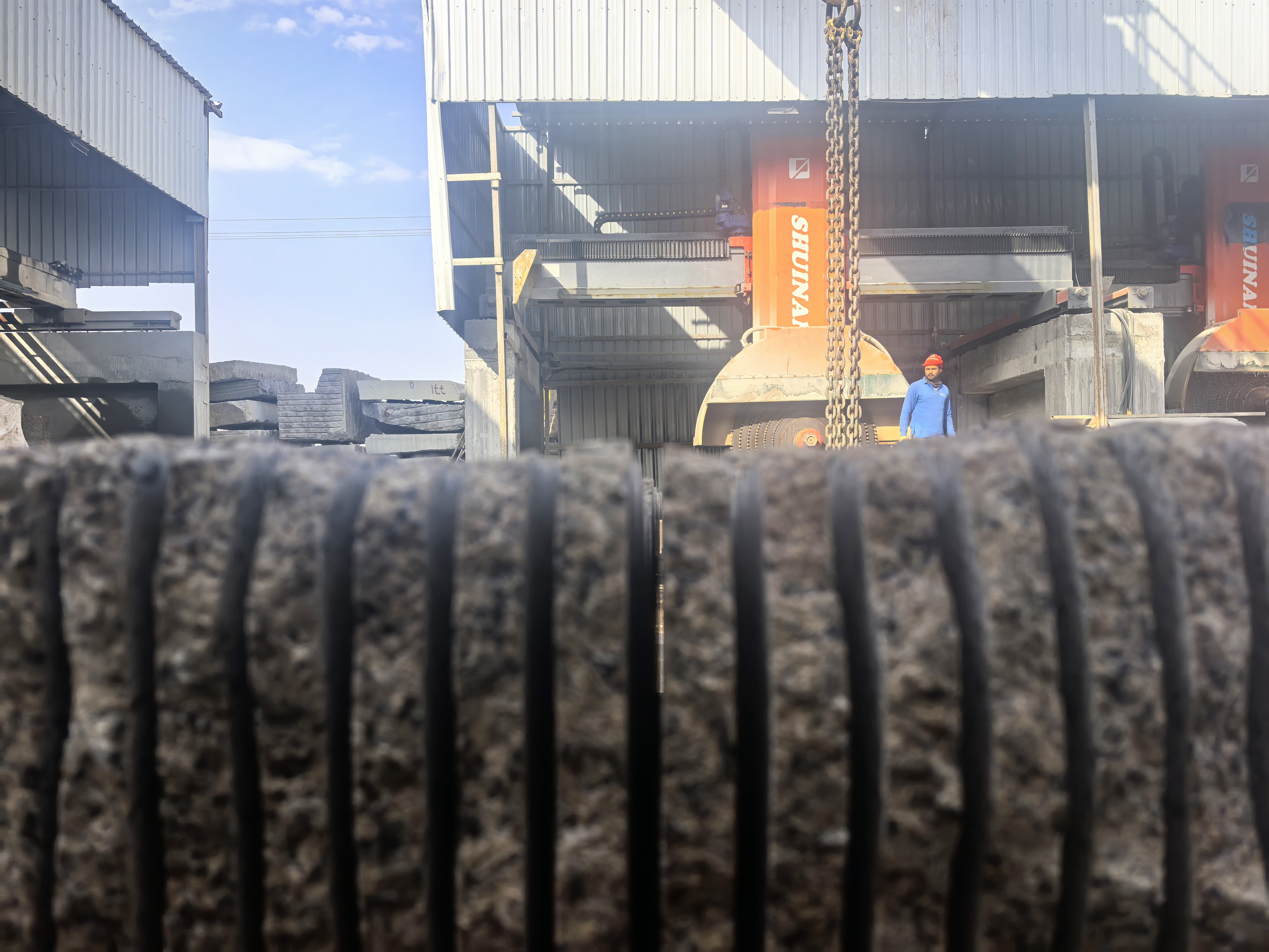 Flat stone slabs after cutting with a multi-blade bridge stone cutting machine