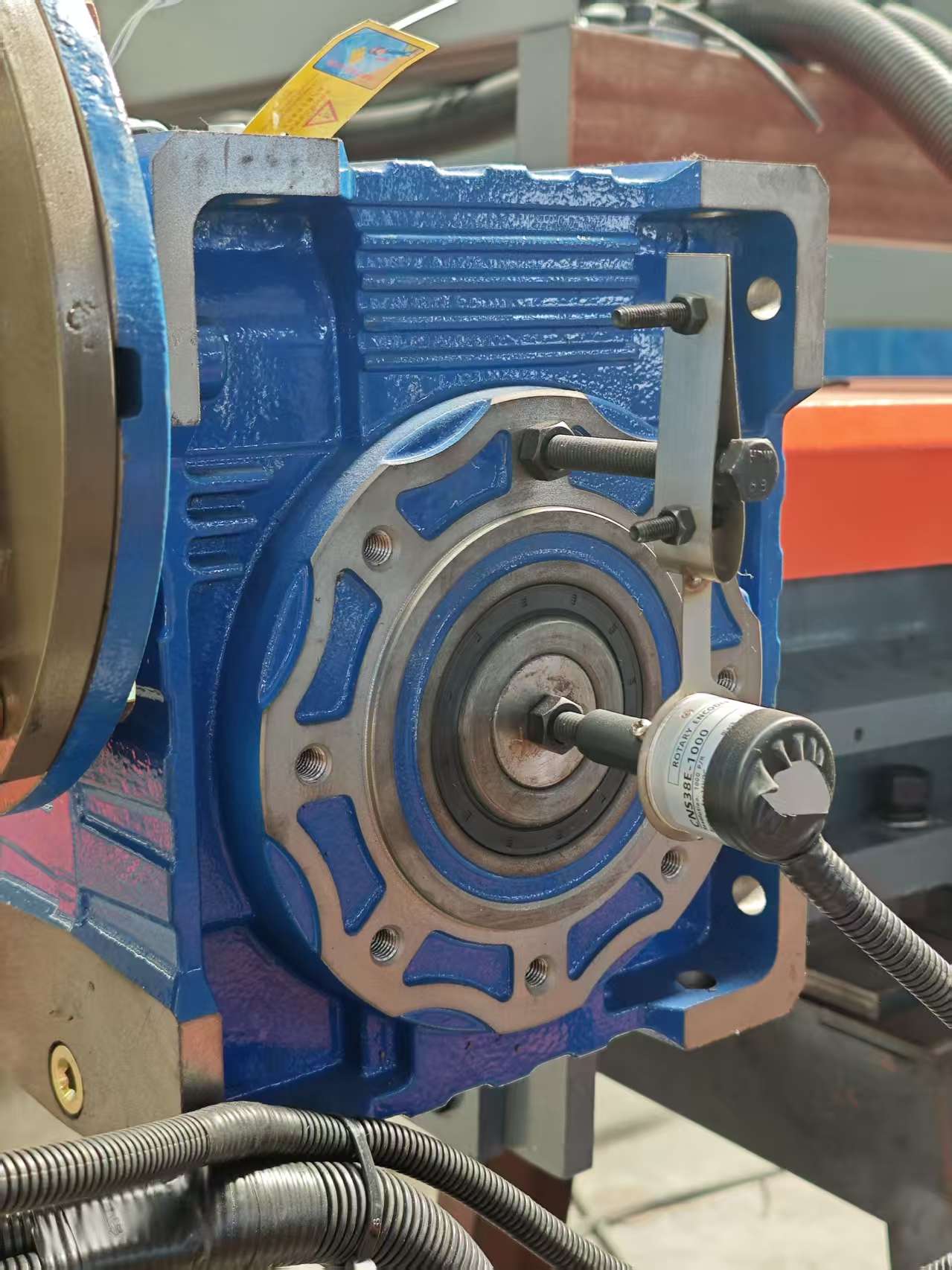 Close-up of the ultra-high precision rotary encoder on the multi-blade bridge stone block cutting machine